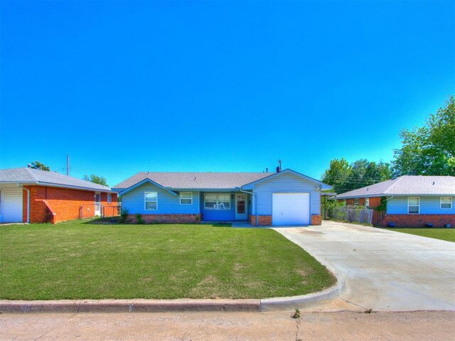 4708 Lisa Ln, Oklahoma City, OK 73115 - ranch-style home with a garage, driveway, and brick siding