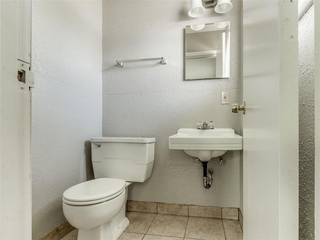 4704 Lisa Ln, Oklahoma City, OK 73115 - half bathroom with toilet and tile patterned flooring