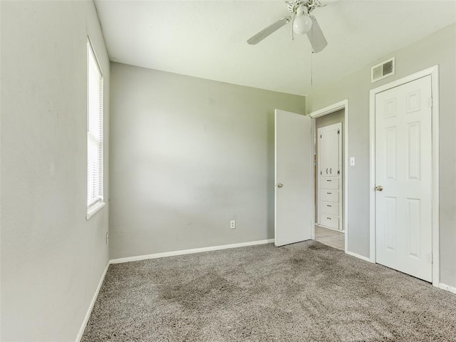 4704 Lisa Ln, Oklahoma City, OK 73115 - unfurnished bedroom with carpet flooring and a ceiling fan