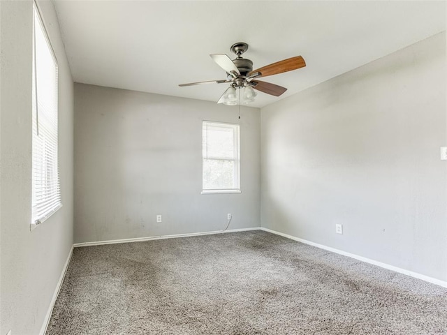 4704 Lisa Ln, Oklahoma City, OK 73115 - empty room featuring carpet and a ceiling fan
