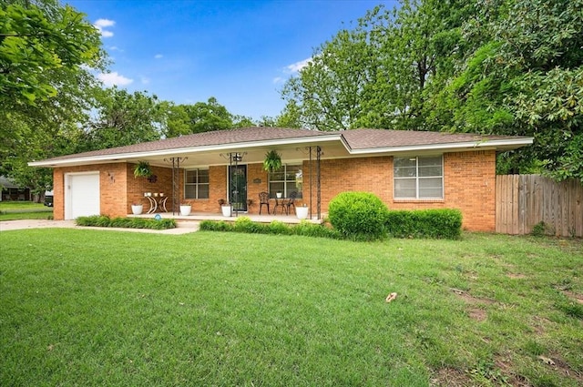 single story home featuring a porch, a garage, concrete driveway, and brick siding