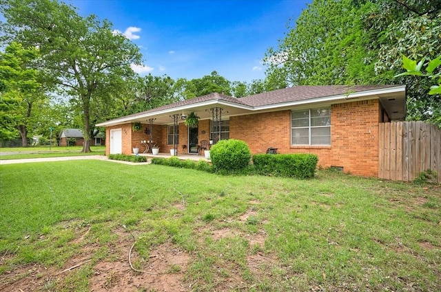 ranch-style house featuring covered porch, a garage, brick siding, and driveway