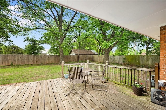 wooden terrace featuring outdoor dining space