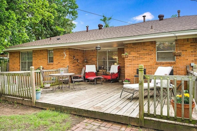 deck featuring outdoor dining area
