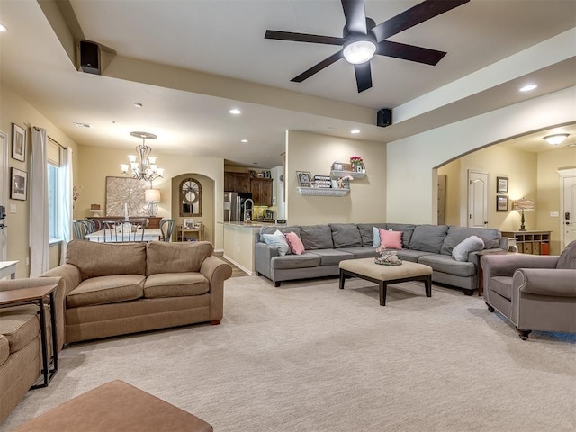 15101 SE 58th St, Choctaw, OK 73020 - living room with light carpet, arched walkways, a chandelier, ceiling fan, and recessed lighting