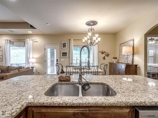 15101 SE 58th St, Choctaw, OK 73020 - kitchen featuring a sink, open floor plan, light stone countertops, decorative light fixtures, and recessed lighting