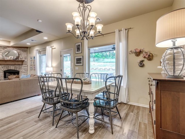 15101 SE 58th St, Choctaw, OK 73020 - dining room with light wood-style flooring, a fireplace, a chandelier, and recessed lighting