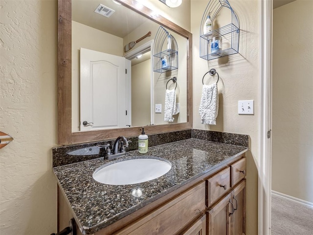 15101 SE 58th St, Choctaw, OK 73020 - bathroom featuring vanity and a textured wall