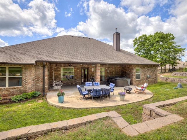 15101 SE 58th St, Choctaw, OK 73020 - rear view of house featuring a hot tub, a patio, a lawn, a chimney, and brick siding