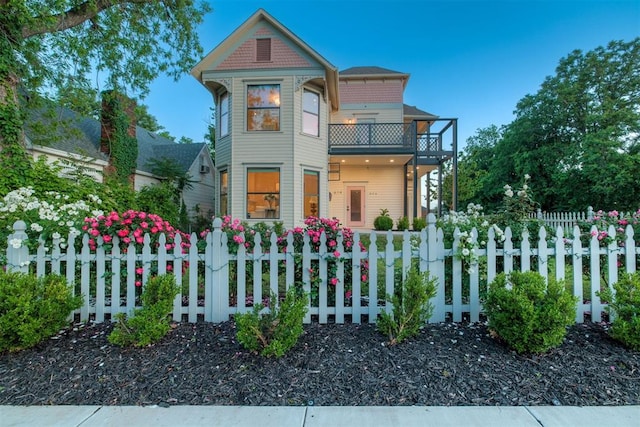614 NW 8th St Unit 1-4, Oklahoma City, OK 73102 - victorian-style house with a fenced front yard and a balcony
