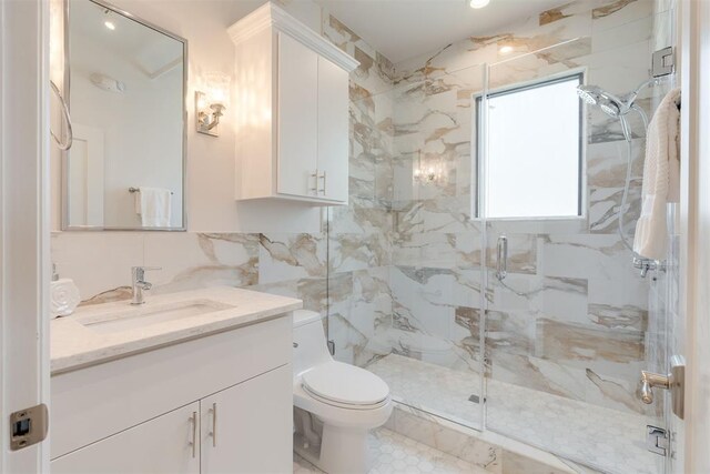 614 NW 8th St Unit 1-4, Oklahoma City, OK 73102 - full bath featuring toilet, a marble finish shower, tile walls, and vanity