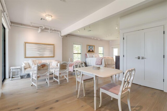 614 NW 8th St Unit 1-4, Oklahoma City, OK 73102 - dining space featuring track lighting and light wood-type flooring