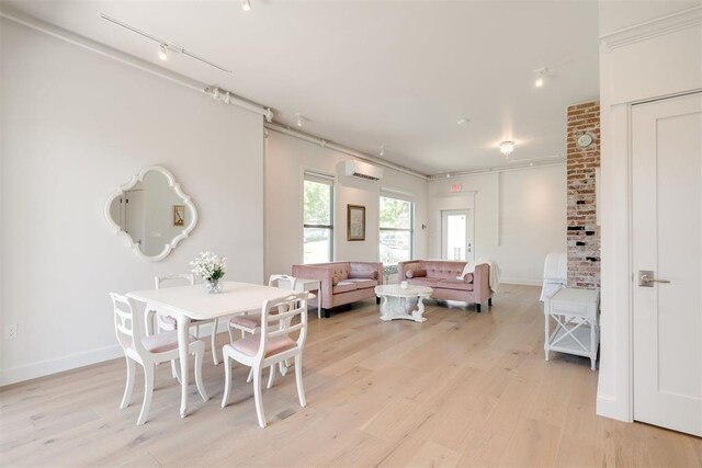 614 NW 8th St Unit 1-4, Oklahoma City, OK 73102 - dining area with a wall mounted AC, light wood-style floors, baseboards, and track lighting