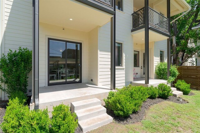 614 NW 8th St Unit 1-4, Oklahoma City, OK 73102 - property entrance with a balcony and fence