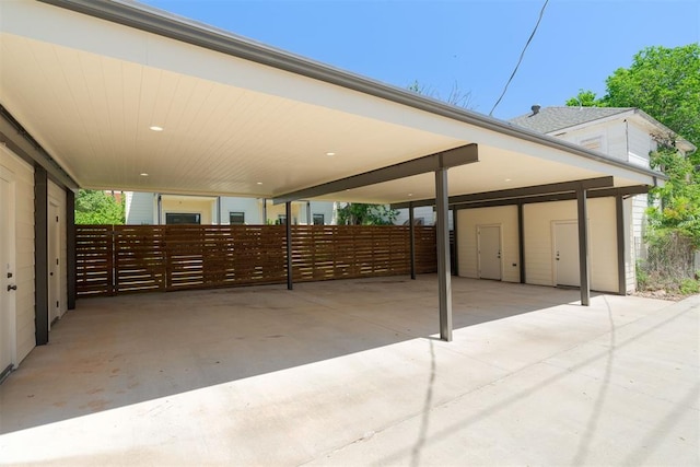 614 NW 8th St Unit 1-4, Oklahoma City, OK 73102 - view of patio / terrace with a carport and fence