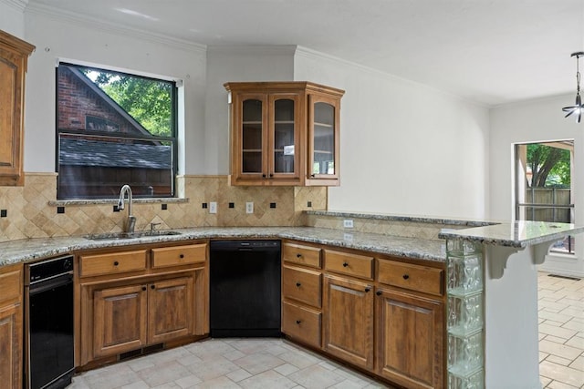 kitchen with a sink, dishwasher, brown cabinets, a peninsula, and light stone counters
