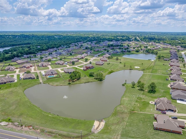 aerial view of residential area featuring a nearby body of water