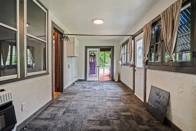 3715 N Mckinley Ave, Oklahoma City, OK 73118 - hallway featuring heating unit, baseboards, and french doors