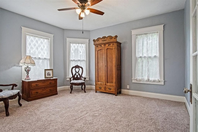 3715 N Mckinley Ave, Oklahoma City, OK 73118 - living area with light colored carpet, a ceiling fan, and baseboards