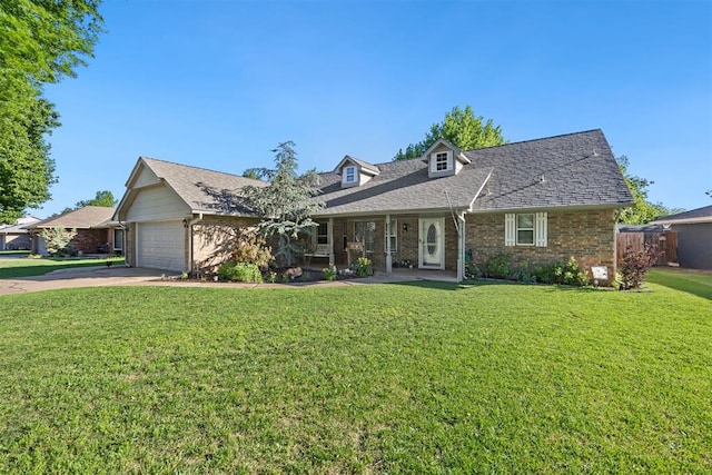 8309 NW 101st St, Oklahoma City, OK 73162 - new england style home with a front yard, driveway, brick siding, a garage, and a shingled roof