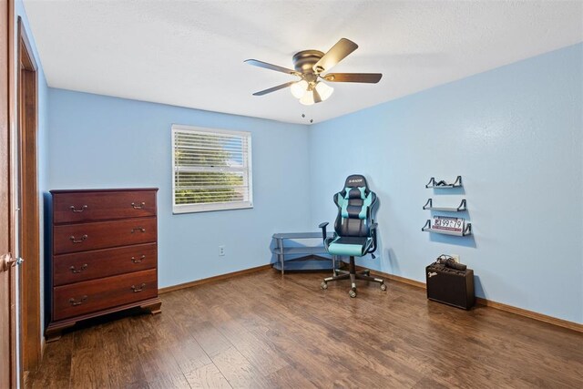 8309 NW 101st St, Oklahoma City, OK 73162 - sitting room with ceiling fan, dark wood-type flooring, and baseboards