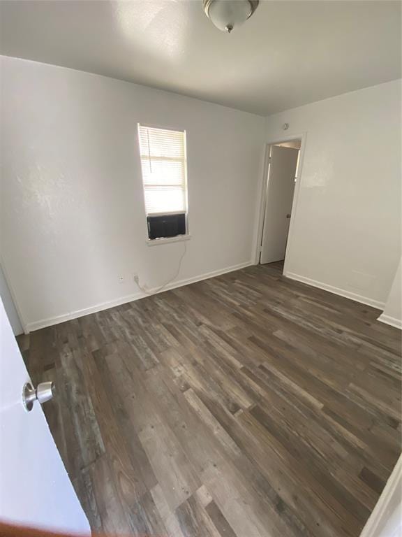 2819 SW 33rd St, Oklahoma City, OK 73119 - spare room featuring dark wood finished floors and baseboards