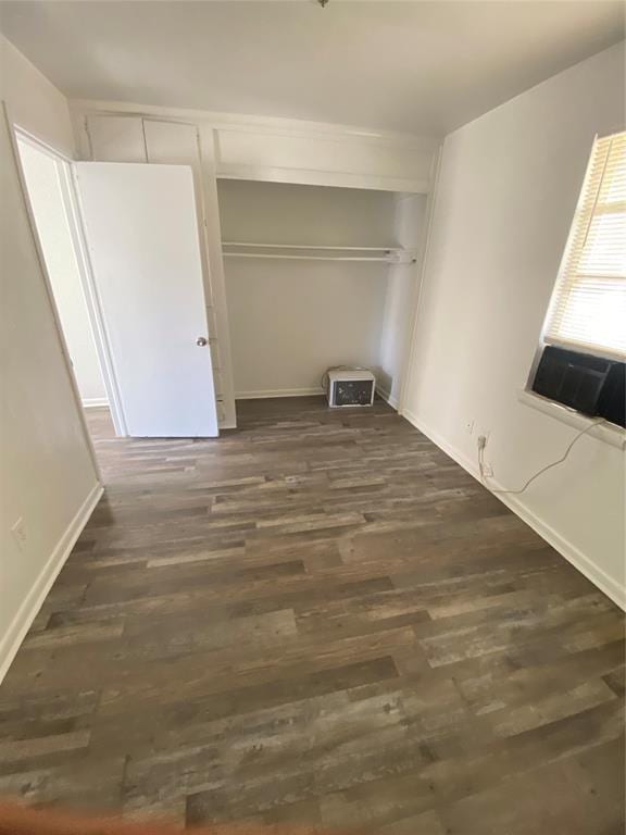 2819 SW 33rd St, Oklahoma City, OK 73119 - unfurnished bedroom featuring dark wood finished floors, cooling unit, and baseboards
