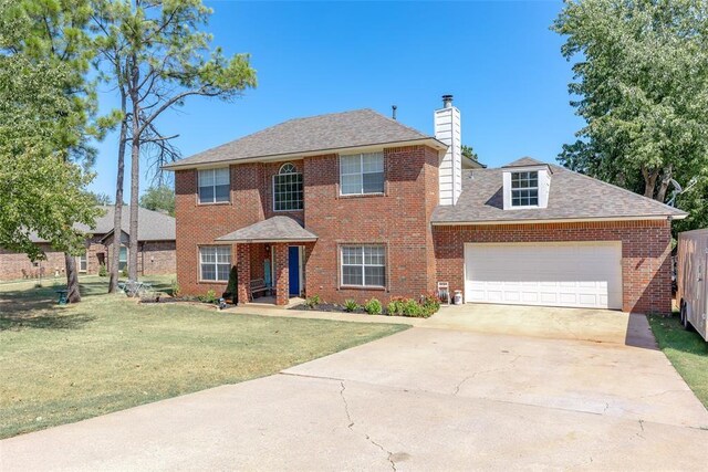 416 S Harrison Ave, Blanchard, OK 73010 - view of front of home with a chimney, a front lawn, an attached garage, driveway, and brick siding
