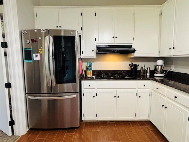 416 S Harrison Ave, Blanchard, OK 73010 - kitchen with smart refrigerator, under cabinet range hood, dark wood-type flooring, black gas cooktop, and white cabinetry
