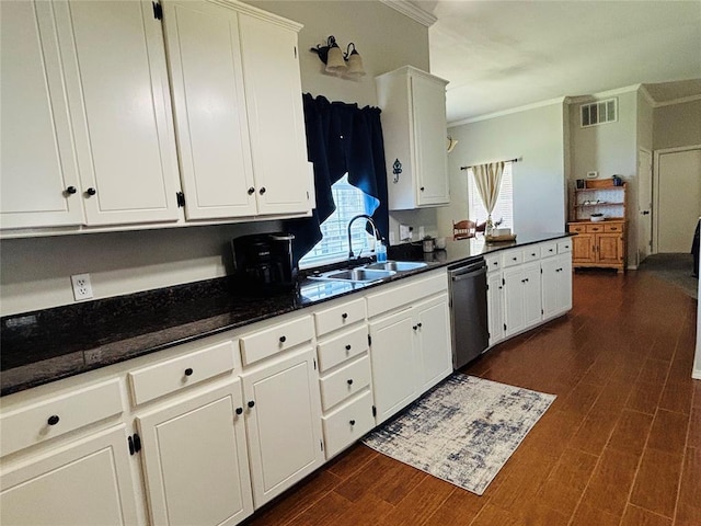 416 S Harrison Ave, Blanchard, OK 73010 - kitchen with stainless steel dishwasher, crown molding, white cabinets, a sink, and dark wood-type flooring