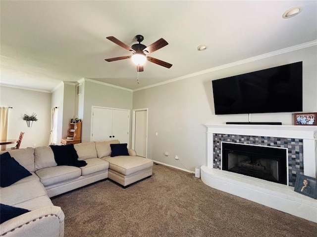 416 S Harrison Ave, Blanchard, OK 73010 - carpeted living room with crown molding, a ceiling fan, a tile fireplace, and baseboards