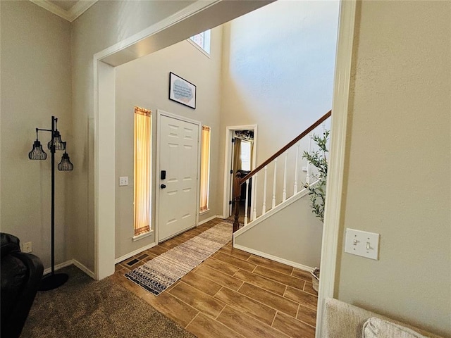 416 S Harrison Ave, Blanchard, OK 73010 - foyer entrance with wood finished floors, stairway, baseboards, and crown molding