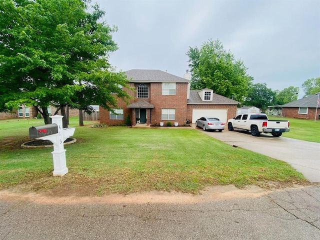 416 S Harrison Ave, Blanchard, OK 73010 - view of front facade with a garage, driveway, a front yard, and brick siding