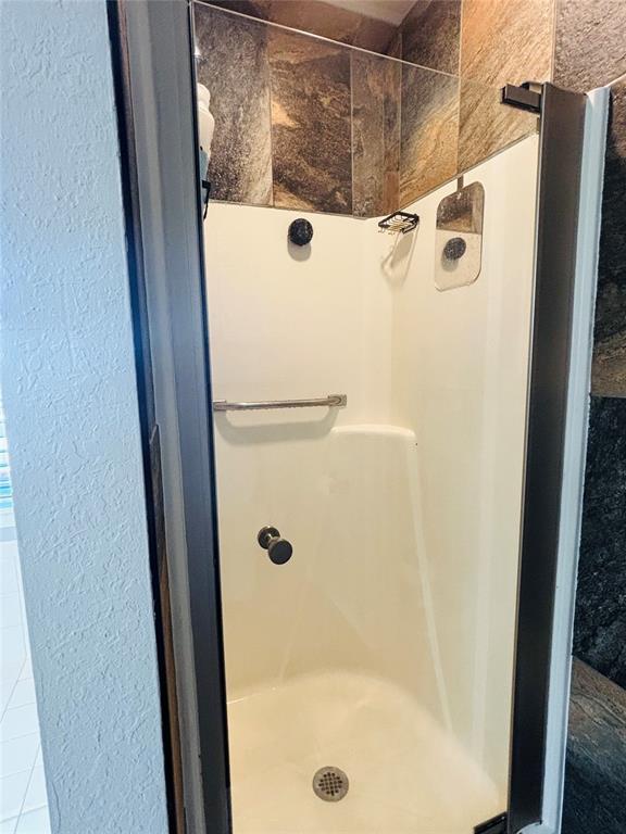 416 S Harrison Ave, Blanchard, OK 73010 - full bathroom with a stall shower