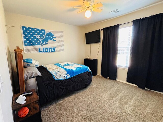 416 S Harrison Ave, Blanchard, OK 73010 - carpeted bedroom with baseboards and ceiling fan