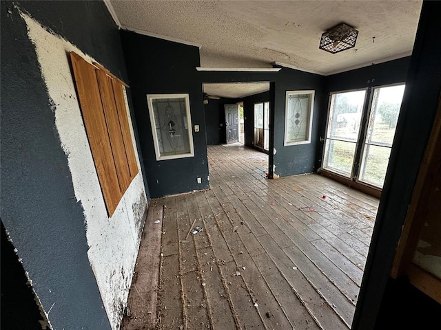 17551 Banner Rd, Lexington, OK 73051 - unfurnished room featuring hardwood / wood-style flooring, a textured ceiling, and ornamental molding