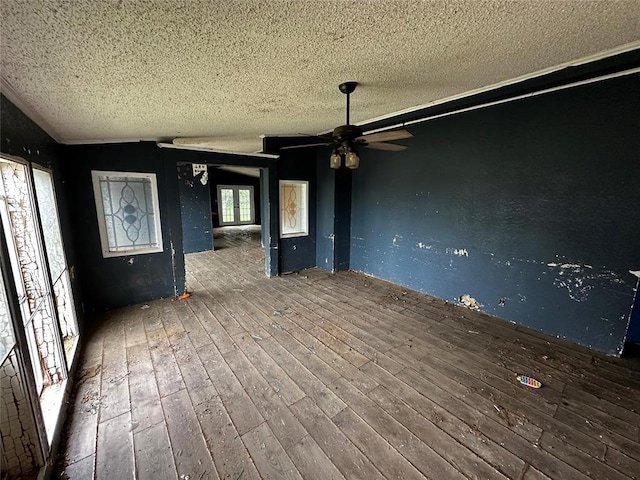17551 Banner Rd, Lexington, OK 73051 - unfurnished dining area featuring a textured ceiling, hardwood / wood-style flooring, and ceiling fan