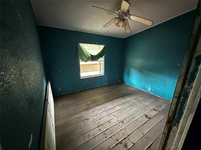 17551 Banner Rd, Lexington, OK 73051 - empty room with hardwood / wood-style flooring and ceiling fan