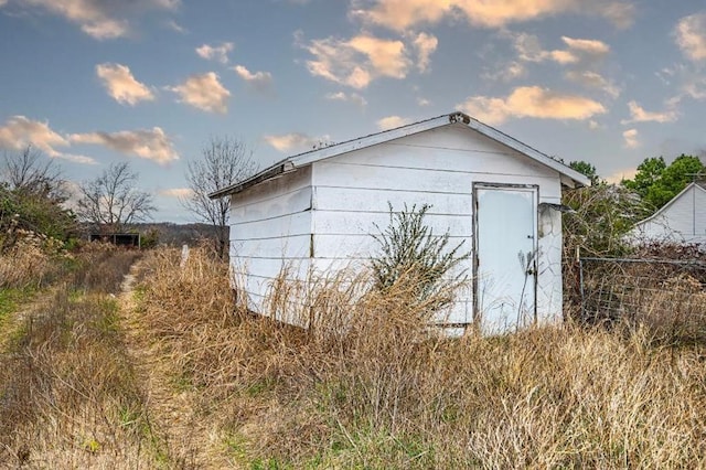 10015 S Bryant Rd, Henryetta, OK 74437 - garage with a storage shed and fence
