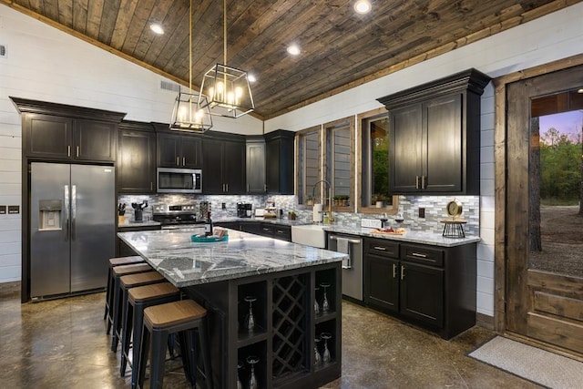 kitchen featuring appliances with stainless steel finishes, wooden ceiling, a sink, light stone countertops, and decorative backsplash