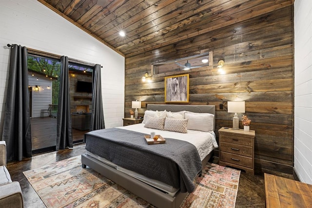 bedroom featuring wooden ceiling, wood walls, and access to outside
