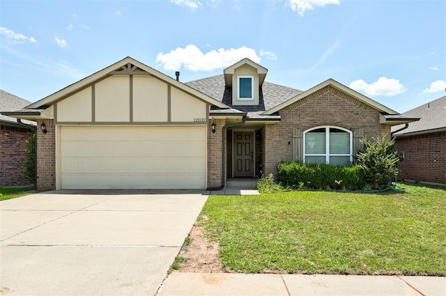 12032 SW 10th St, Yukon, OK 73099 - view of front facade featuring brick siding, a front lawn, roof with shingles, driveway, and an attached garage