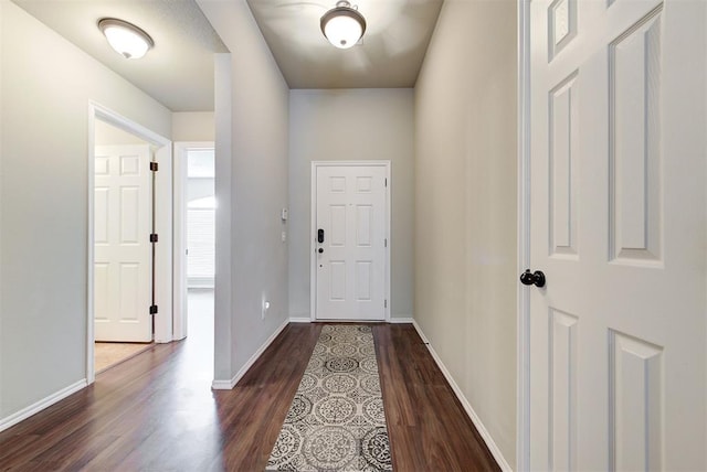 12032 SW 10th St, Yukon, OK 73099 - entryway with dark wood-type flooring and baseboards