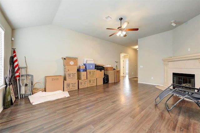 12032 SW 10th St, Yukon, OK 73099 - living area with ceiling fan, wood finished floors, a fireplace, and vaulted ceiling