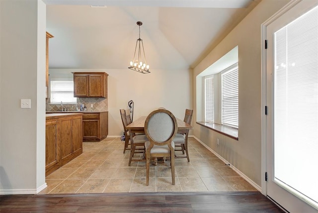12032 SW 10th St, Yukon, OK 73099 - dining area with a chandelier and lofted ceiling