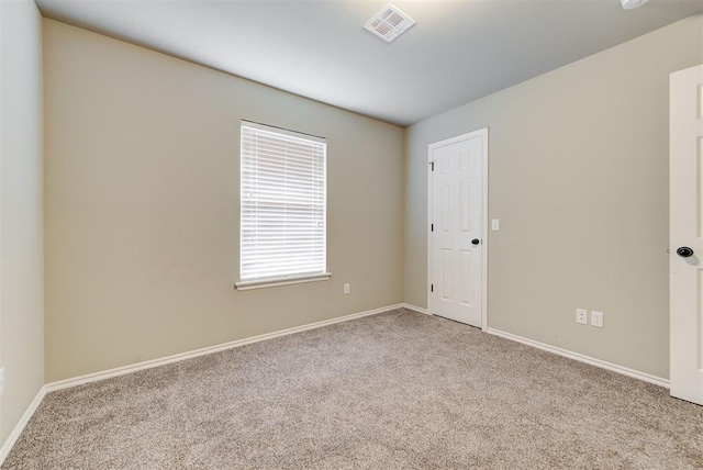 12032 SW 10th St, Yukon, OK 73099 - spare room with carpet floors and baseboards