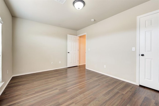 12032 SW 10th St, Yukon, OK 73099 - spare room with wood finished floors and a smoke detector