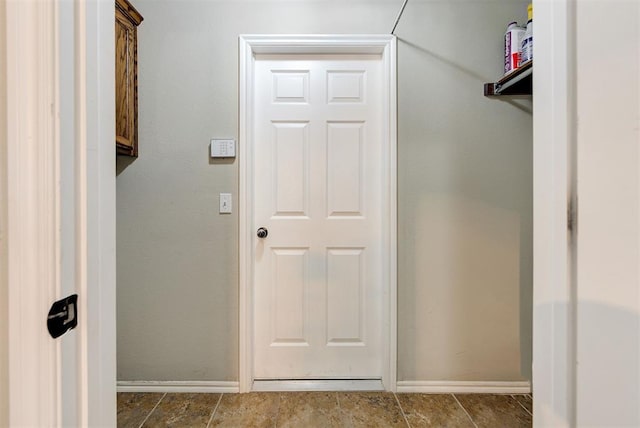 12032 SW 10th St, Yukon, OK 73099 - spacious closet featuring tile patterned flooring