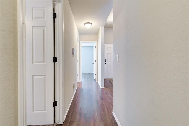 12032 SW 10th St, Yukon, OK 73099 - hallway with dark wood-style flooring and baseboards