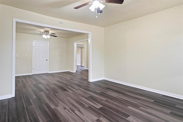 436 SE 54th St, Oklahoma City, OK 73129 - spare room featuring a ceiling fan, dark wood-style floors, and baseboards